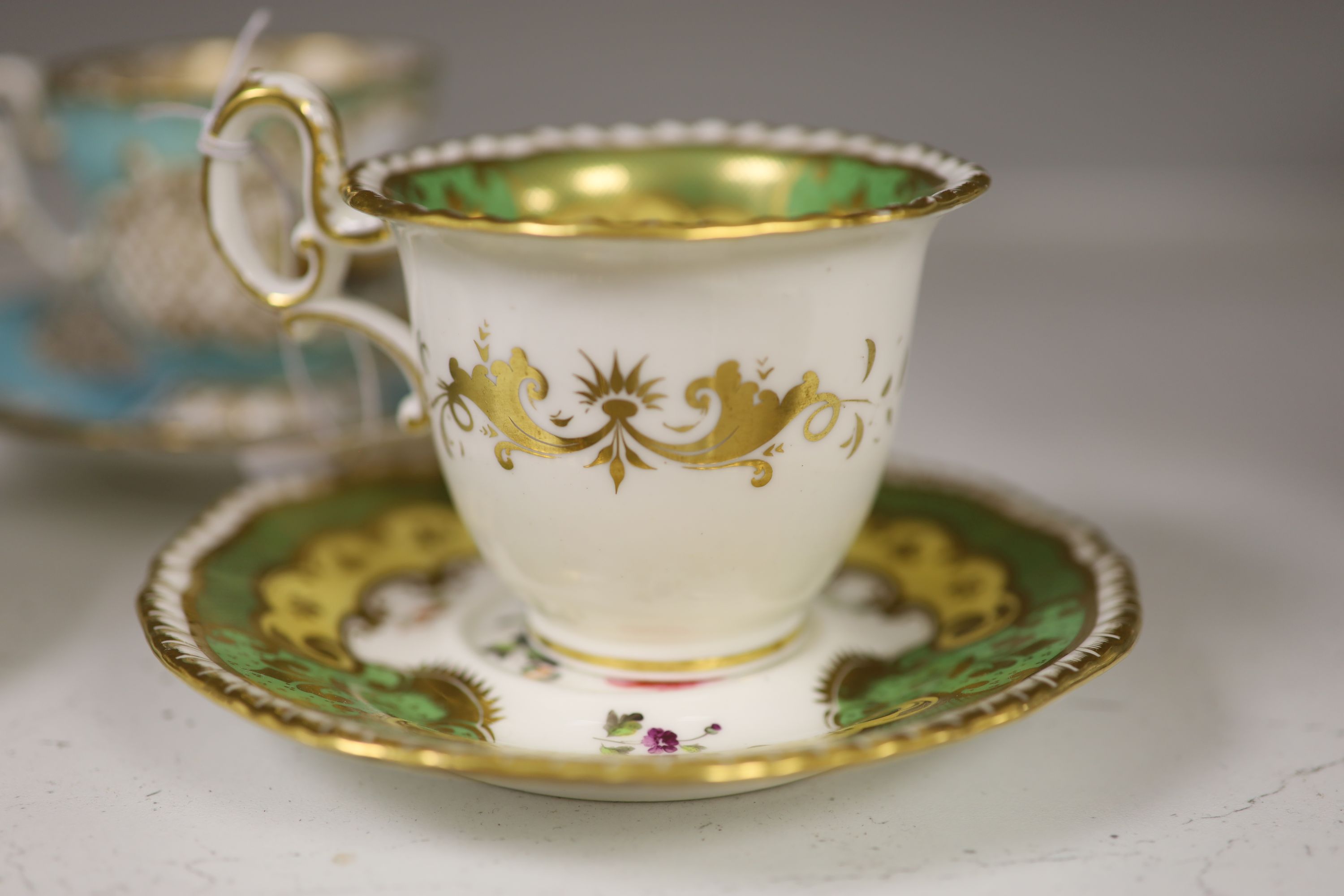 A Spode cup and saucer decorated with raised gilt birds and a basket with green leaves, marked Spode 3916, a Copeland and Garrett turqu